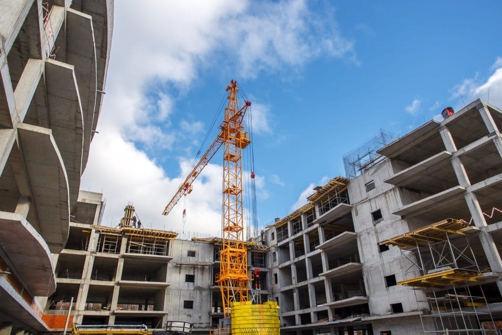 Construction Crane and Commercial Building Maintenance in Progress