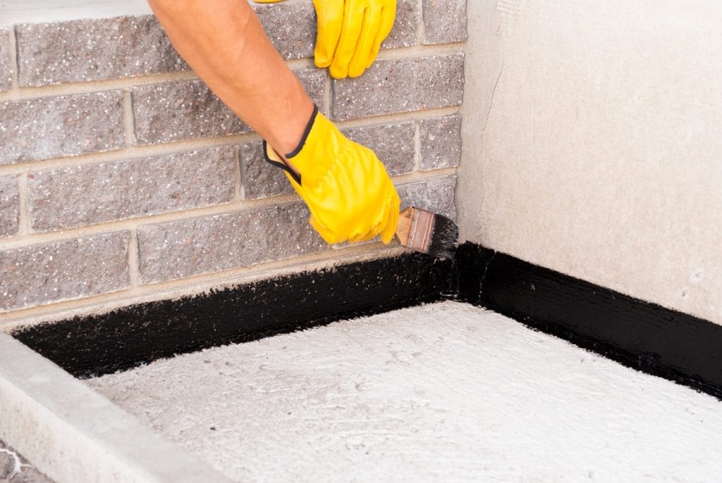 Applying Waterproofing Coating on the Basement Wall
