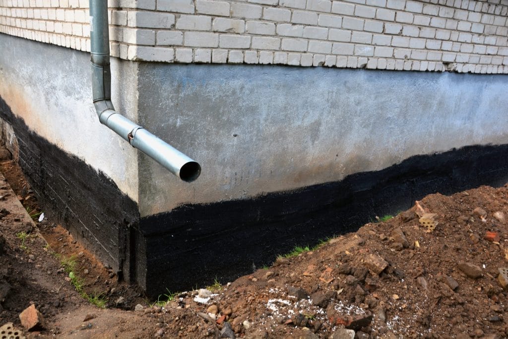 Basement Waterproofing Application on Foundation Wall
